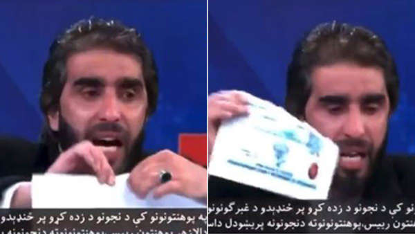 Afghan professor tears diploma certificates in protest against women university ban .